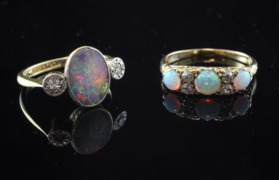 Two opal & diamond rings.